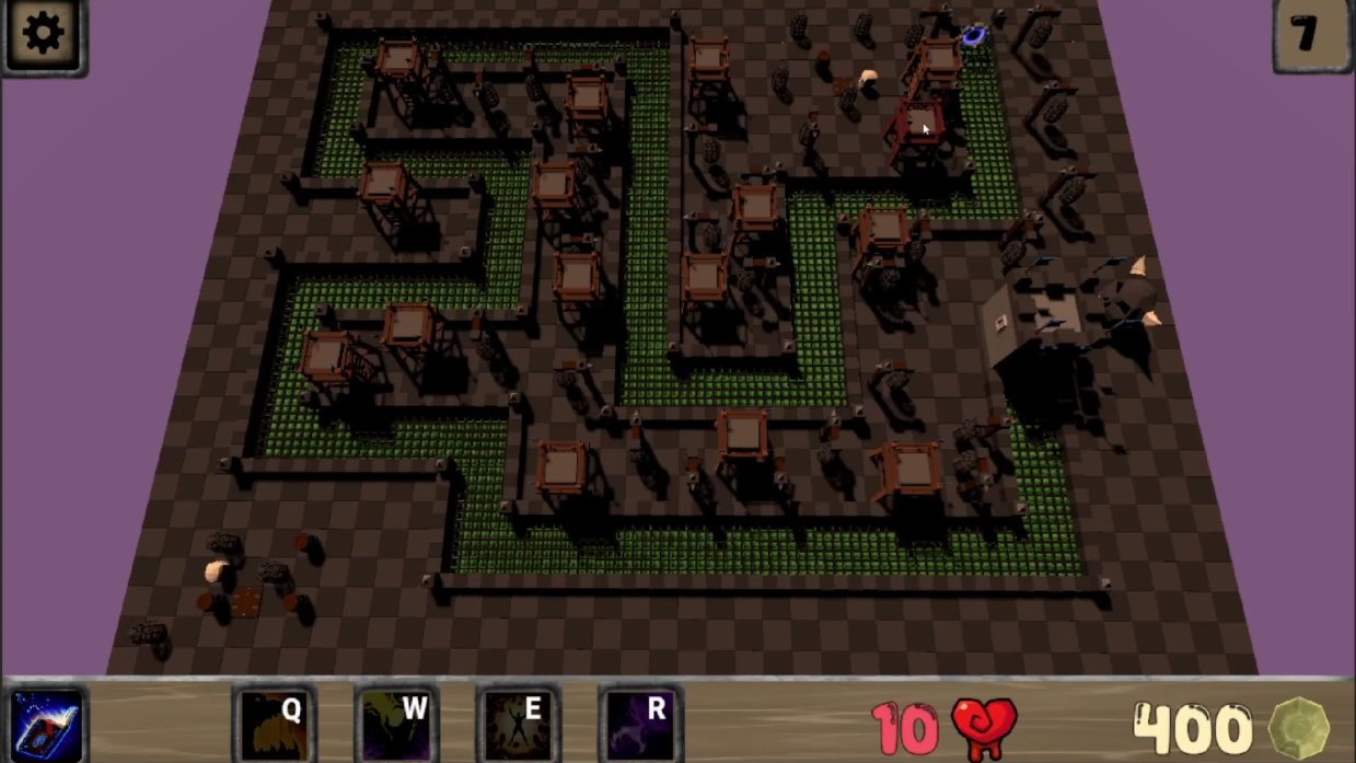 A maze of hedges and towers on a dark night level